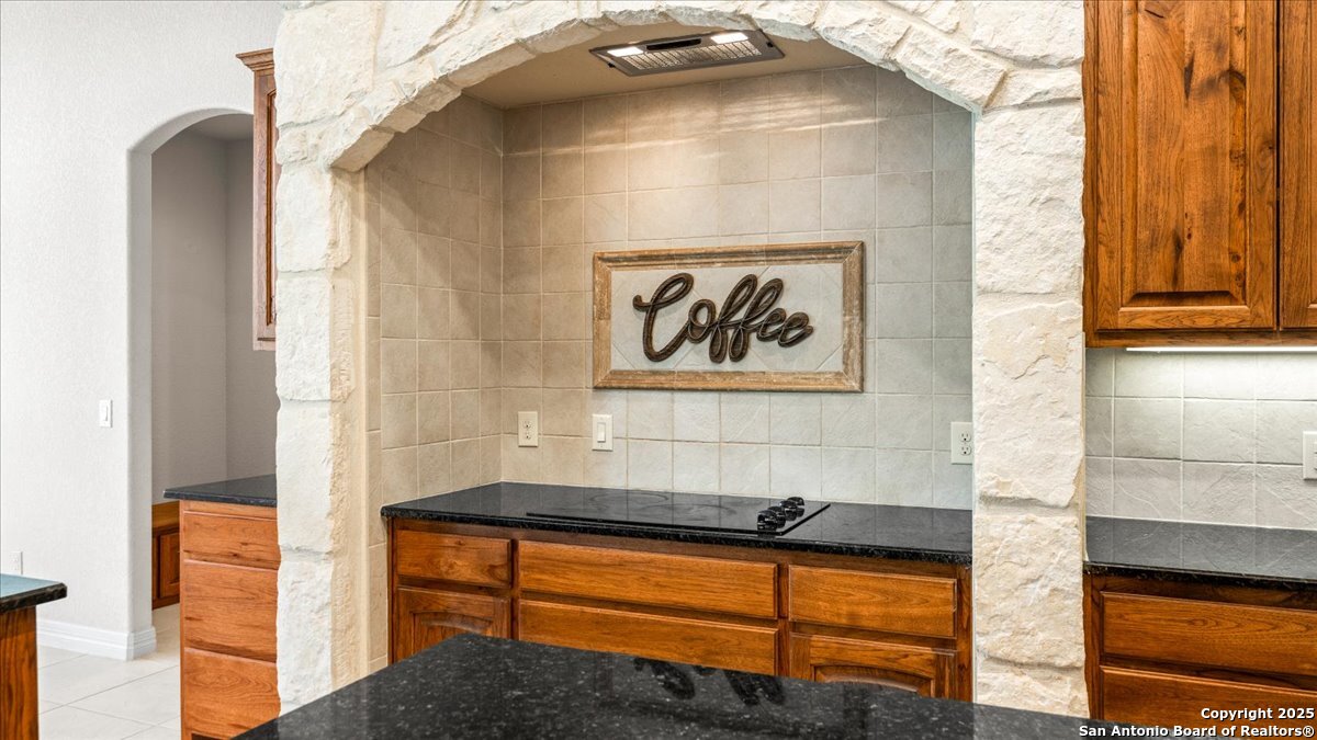 8018 Canham Ranch Garden Ridge, TX 78266 - Photo 16 of 51 a bathroom with a bathtub and a shower