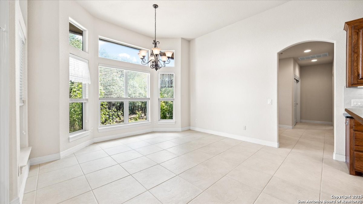 8018 Canham Ranch Garden Ridge, TX 78266 - Photo 19 of 51 a view of an empty room with a window