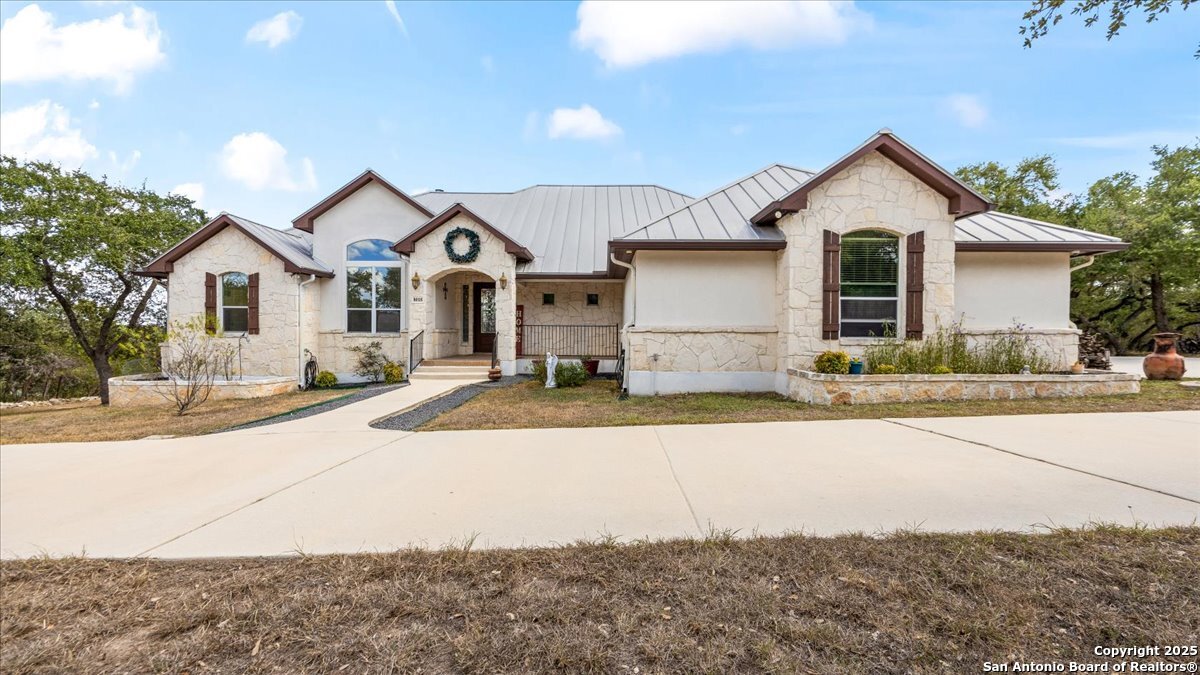 8018 Canham Ranch Garden Ridge, TX 78266 - Photo 2 of 51 a front view of a house with a yard