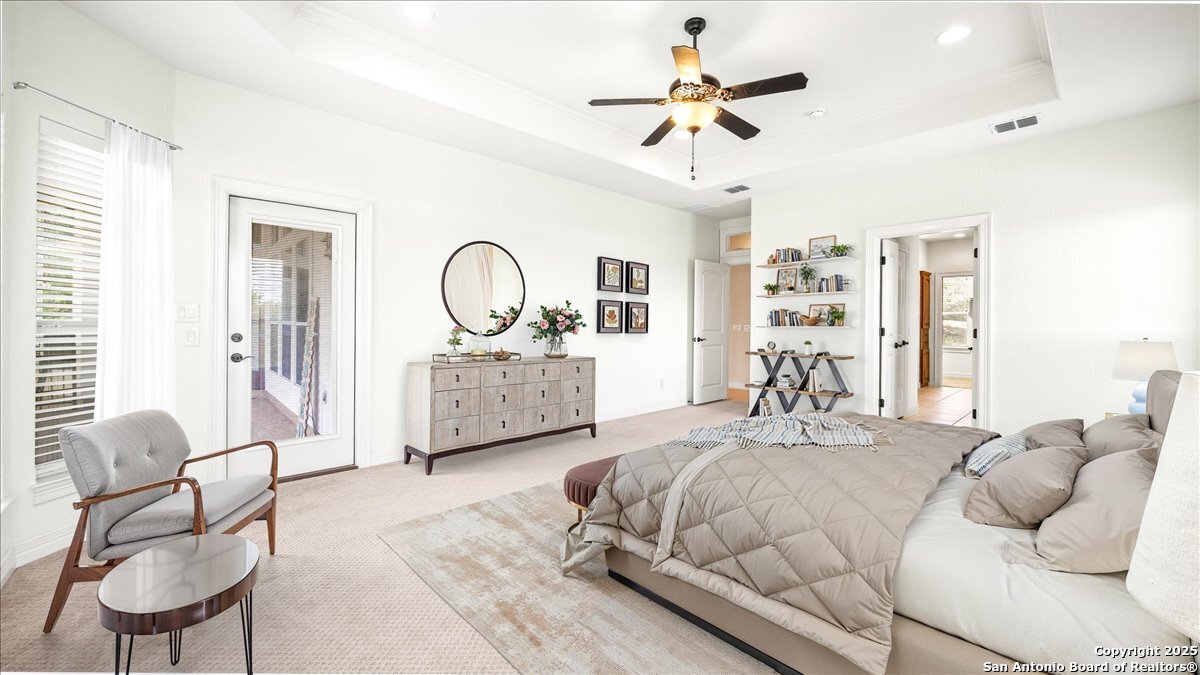 8018 Canham Ranch Garden Ridge, TX 78266 - Photo 21 of 51 a bedroom with a bed a couch and dresser