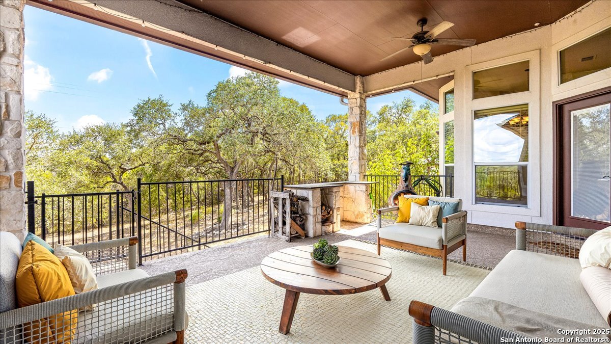8018 Canham Ranch Garden Ridge, TX 78266 - Photo 33 of 51 a balcony with furniture and a potted plant