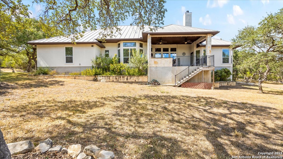 8018 Canham Ranch Garden Ridge, TX 78266 - Photo 36 of 51 a view of a house with a yard