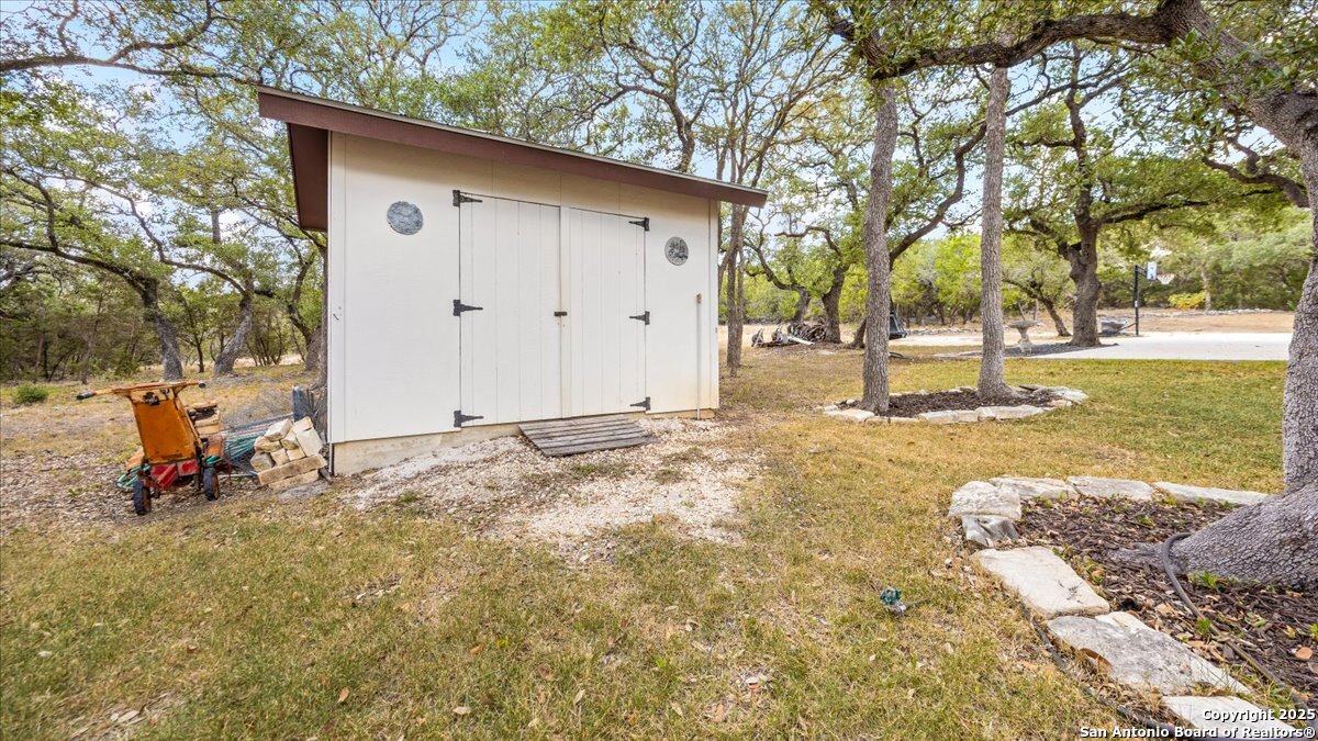 8018 Canham Ranch Garden Ridge, TX 78266 - Photo 38 of 51 a backyard of a house with lots of green space