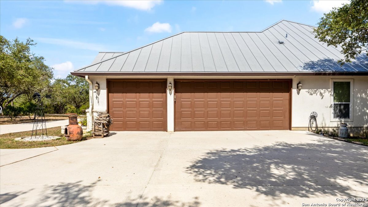 8018 Canham Ranch Garden Ridge, TX 78266 - Photo 41 of 51 a front view of a house with a outdoor space and parking