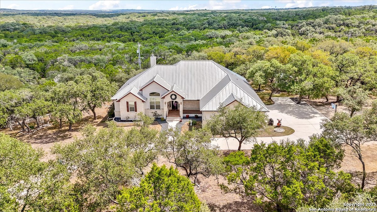 8018 Canham Ranch Garden Ridge, TX 78266 - Photo 42 of 51 a view of a house with a yard