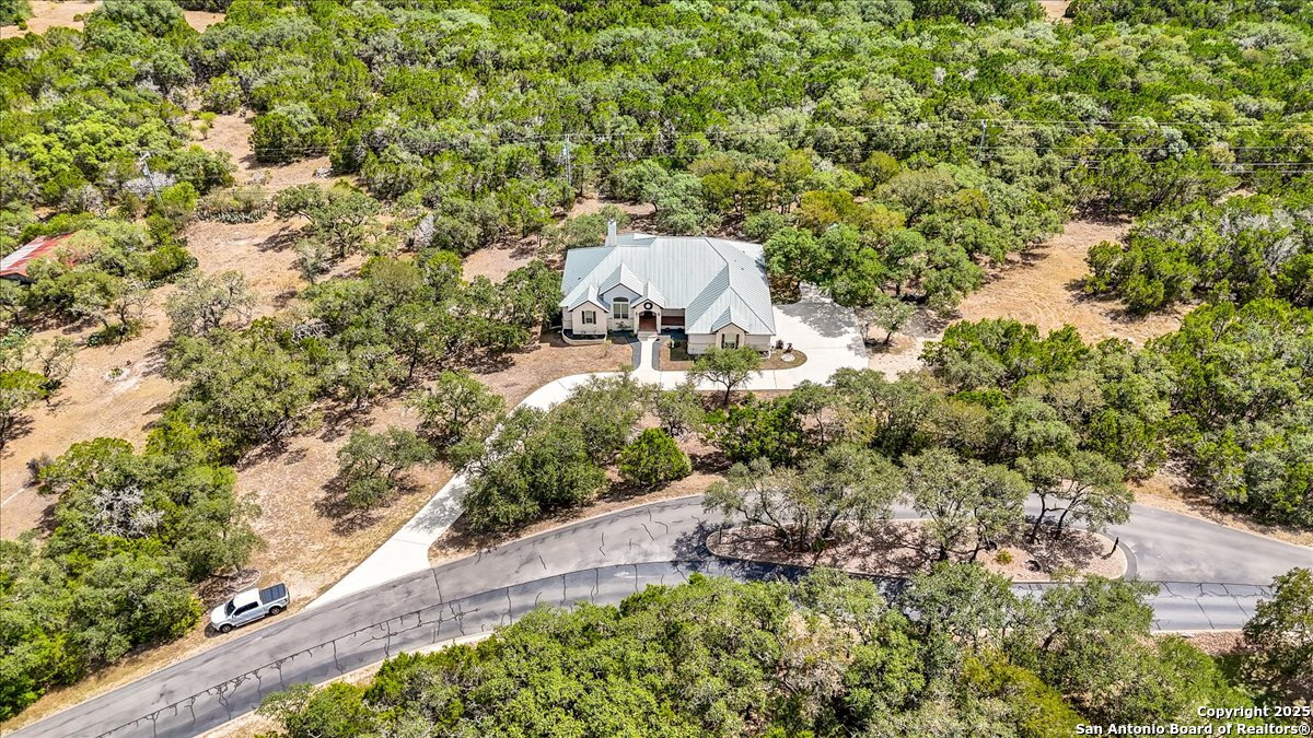 8018 Canham Ranch Garden Ridge, TX 78266 - Photo 44 of 51 a view of a garden with a tree