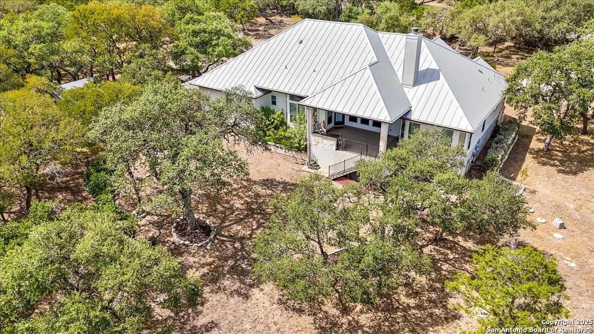 8018 Canham Ranch Garden Ridge, TX 78266 - Photo 48 of 51 a aerial view of a house with a yard and sitting area