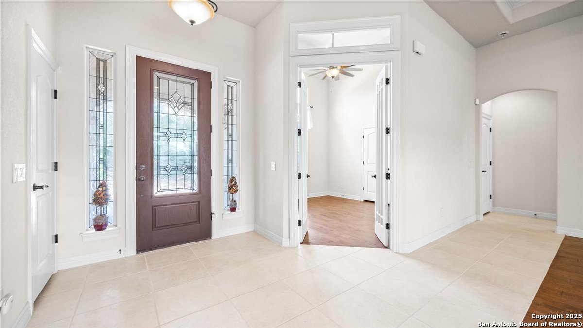 8018 Canham Ranch Garden Ridge, TX 78266 - Photo 7 of 51 a bedroom with a bed and a window