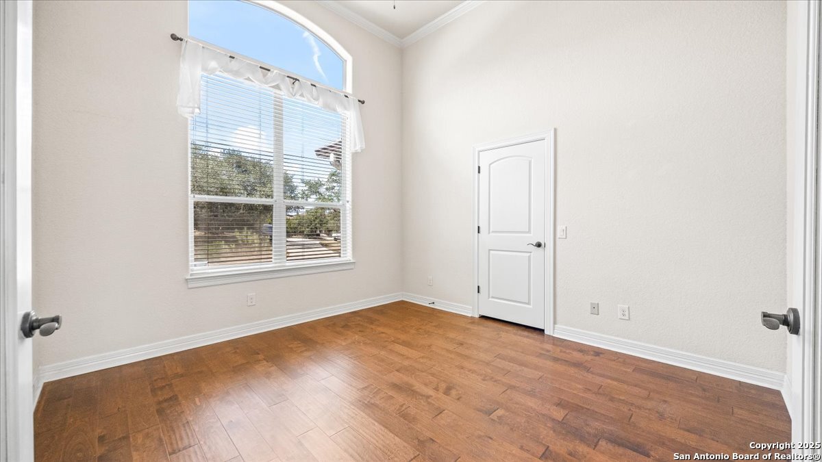 8018 Canham Ranch Garden Ridge, TX 78266 - Photo 8 of 51 an empty room with a window