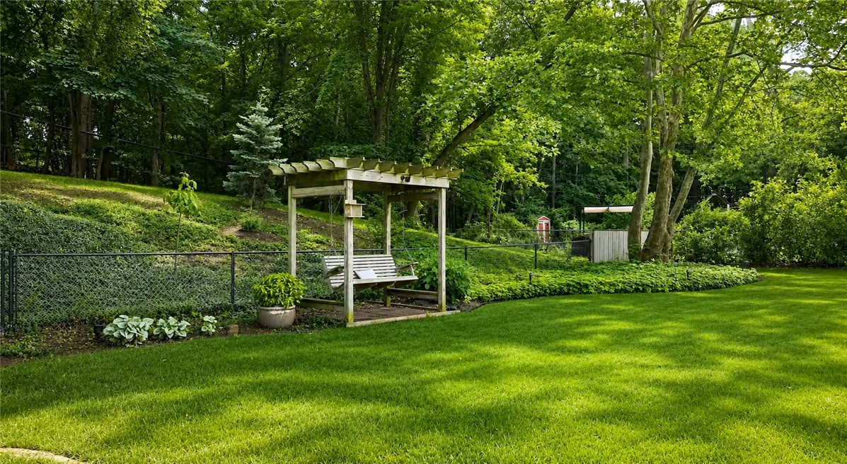 175 Longview Drive Webster, NY 14580 - Photo 45 of 47 Yard extends beyond the fenced in area - backing t