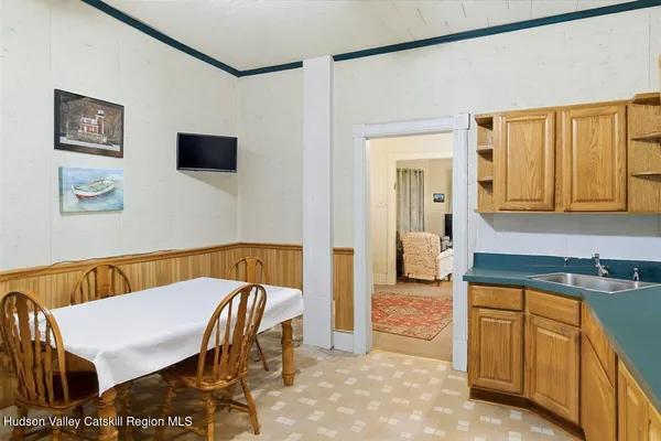 a balcony with table and chairs