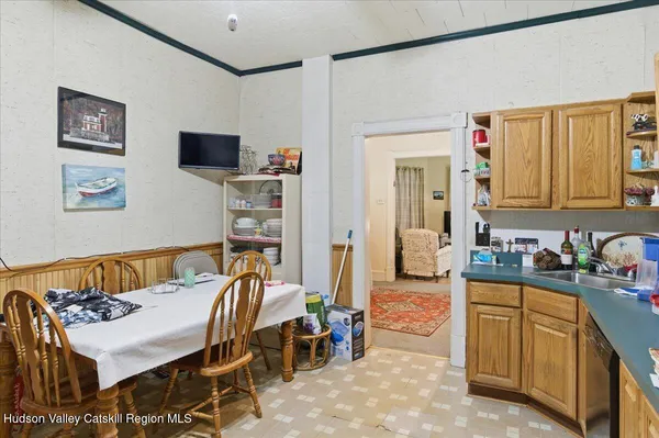a bedroom with furniture and a wooden floor