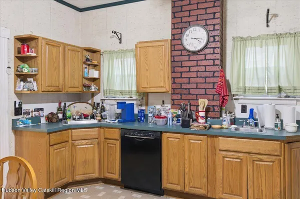 a kitchen with stainless steel appliances granite countertop a sink and cabinets
