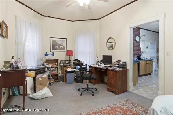 a bedroom with a bed and a furniture