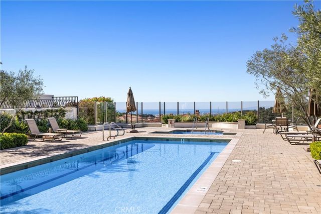 a view of a swimming pool with a lounge chair