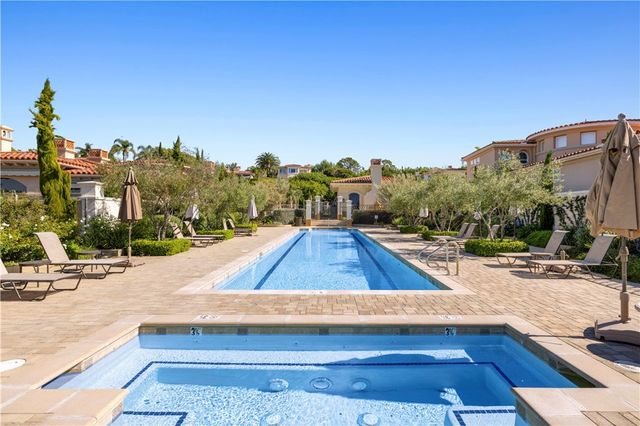 a view of a swimming pool with a lounge chairs