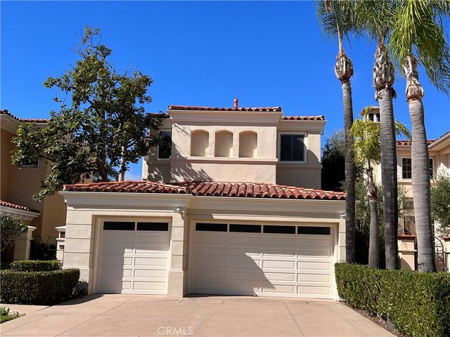 a front view of a house with a garage