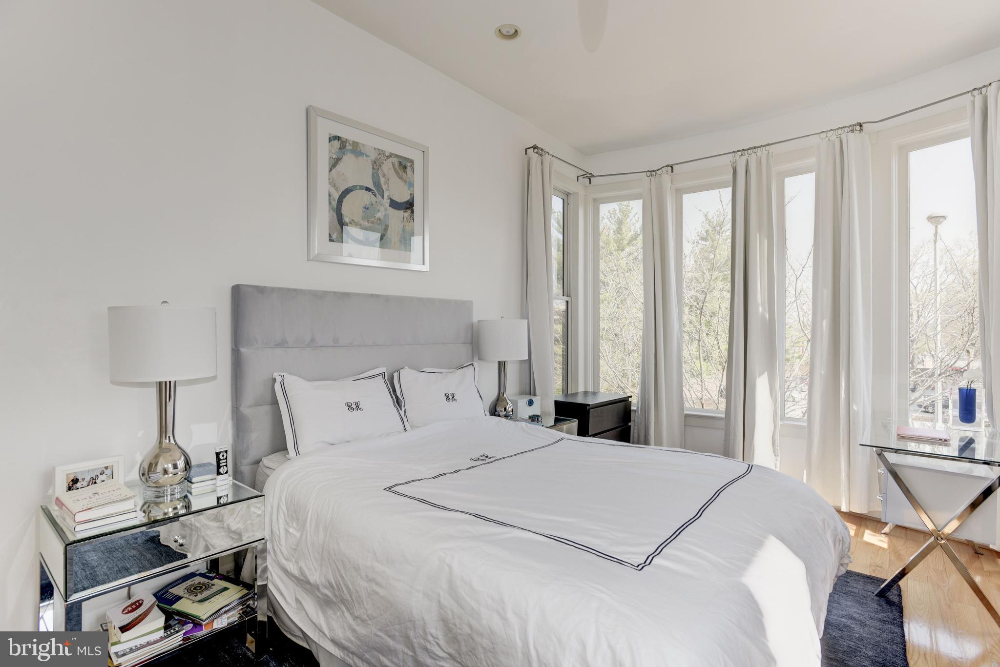 1240 4th Street Northwest, Unit 200 Washington, DC 20001 - Photo 11 of 18 a bedroom with a bed and a window