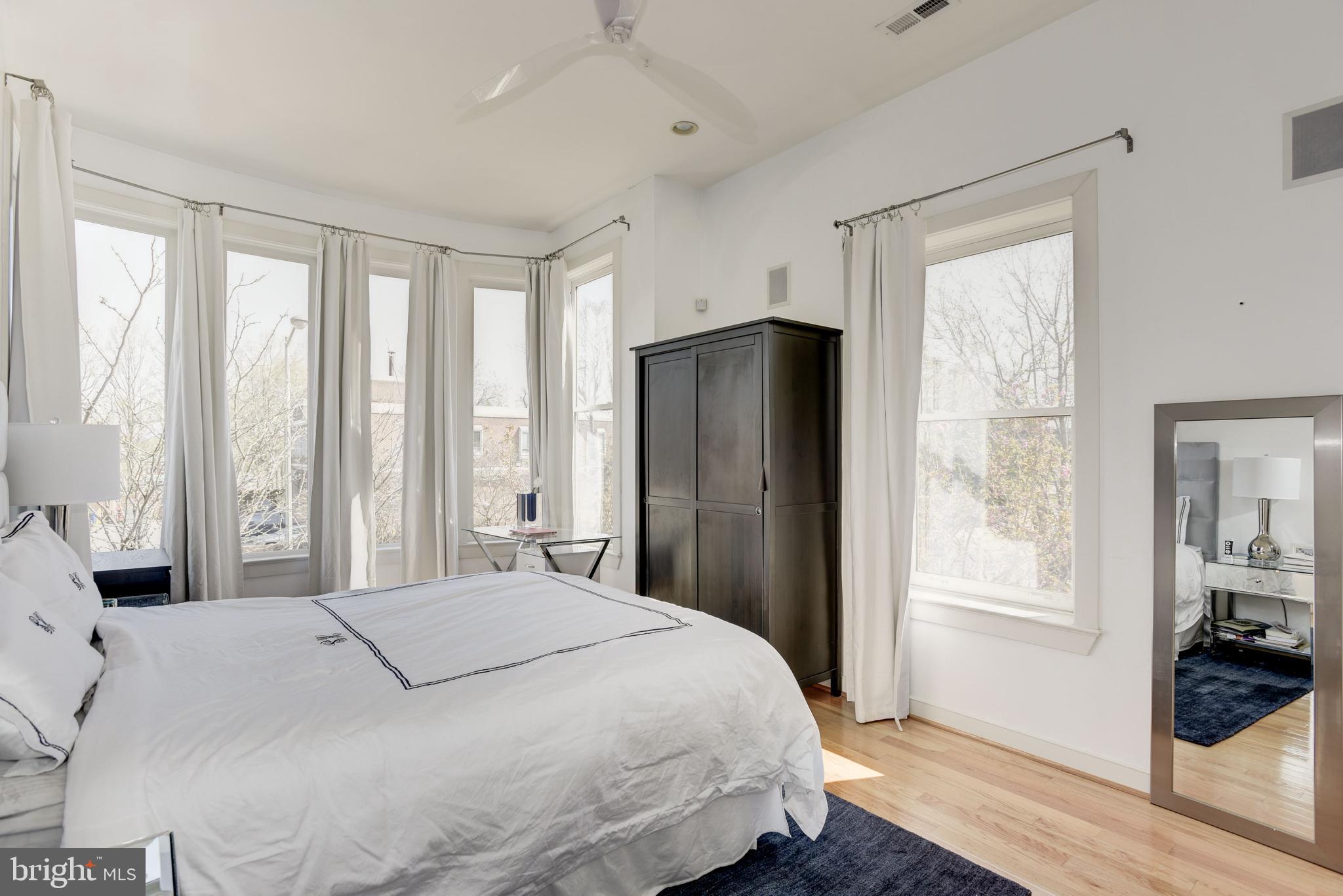 1240 4th Street Northwest, Unit 200 Washington, DC 20001 - Photo 12 of 18 a bedroom with a large bed and a window