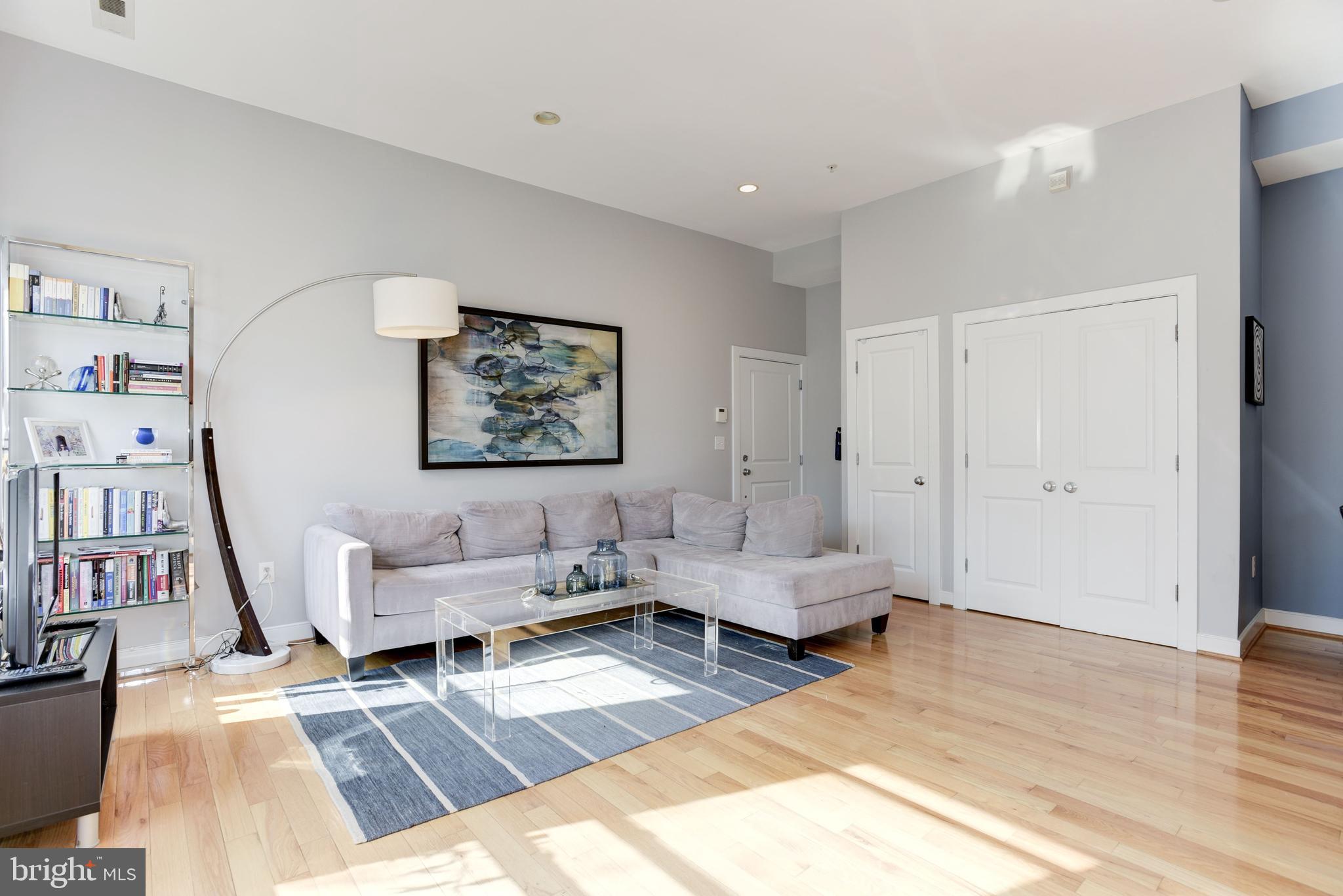 1240 4th Street Northwest, Unit 200 Washington, DC 20001 - Photo 4 of 18 a living room with furniture and a wooden floor
