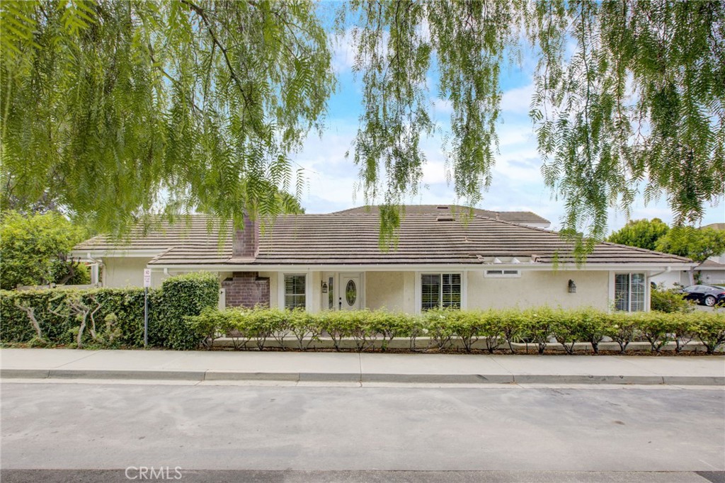 12 Cedarlake, Unit 3 Irvine, CA 92614 - Photo 1 of 1 a front view of a house with a garden