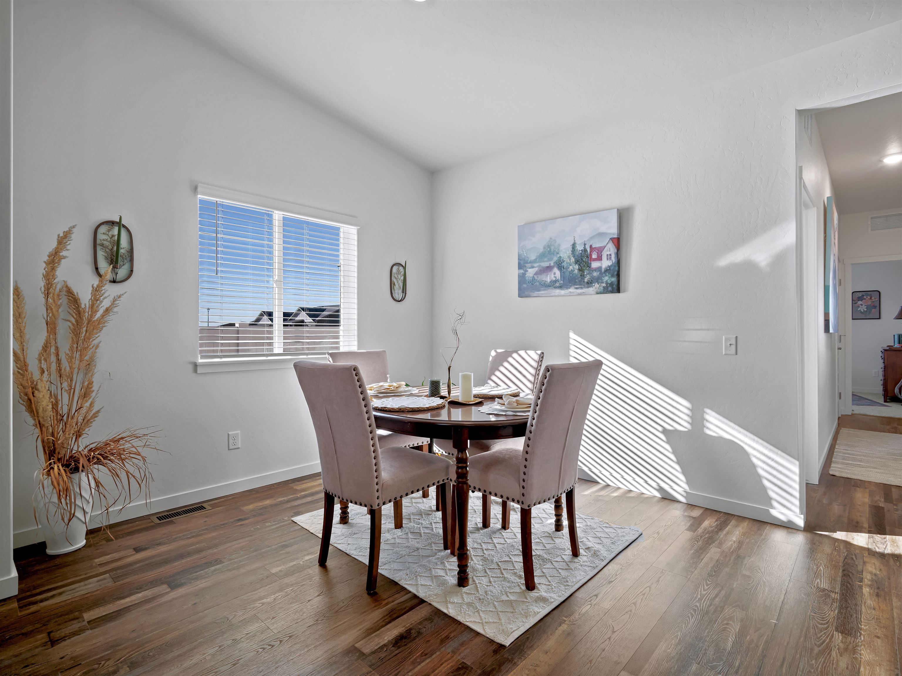 2147 Moon River Road Grand Junction, CO 81505 - Photo 14 of 34 a view of a dining room with furniture and wooden floor