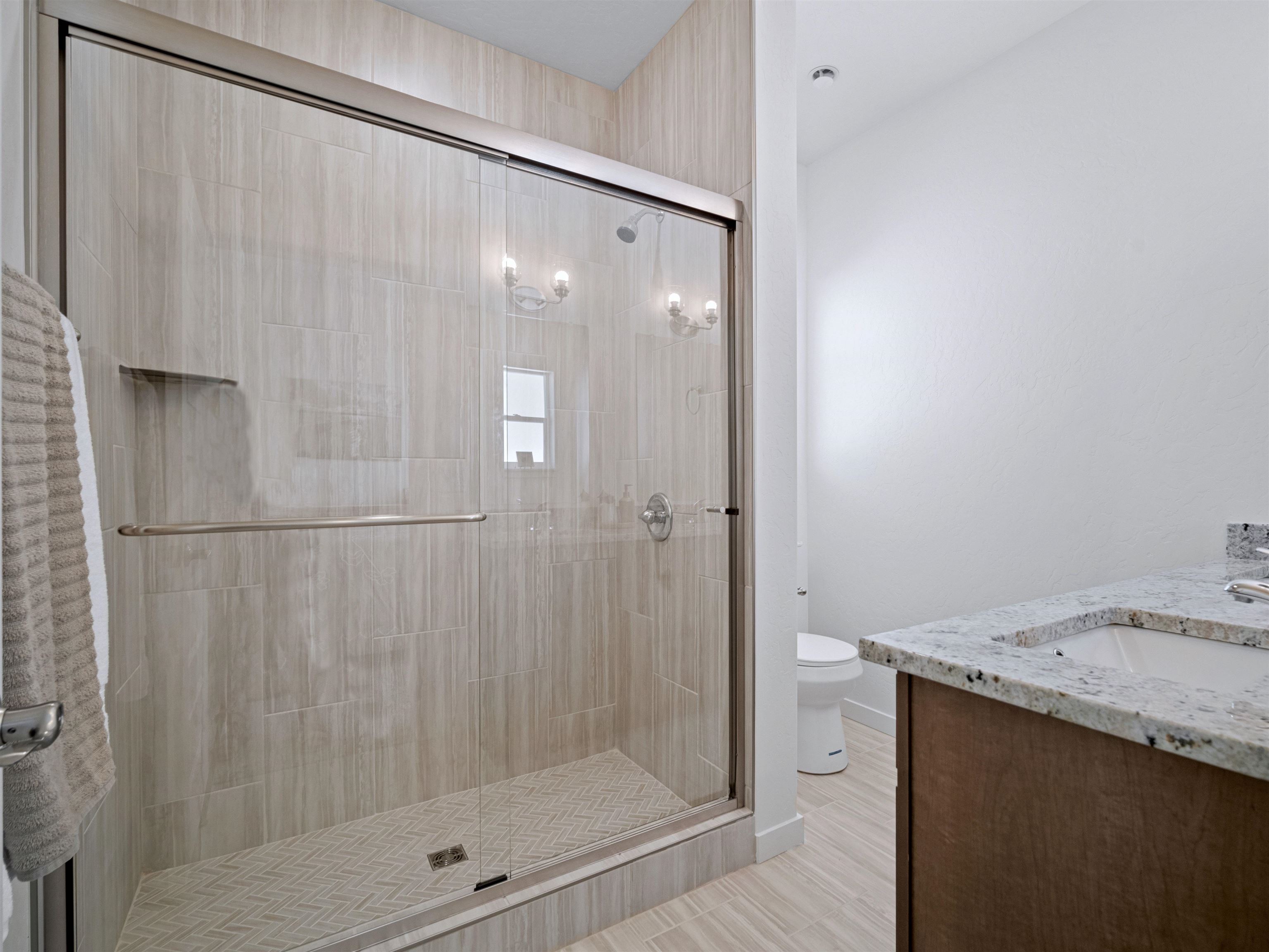 2147 Moon River Road Grand Junction, CO 81505 - Photo 19 of 34 a bathroom with a shower and a sink