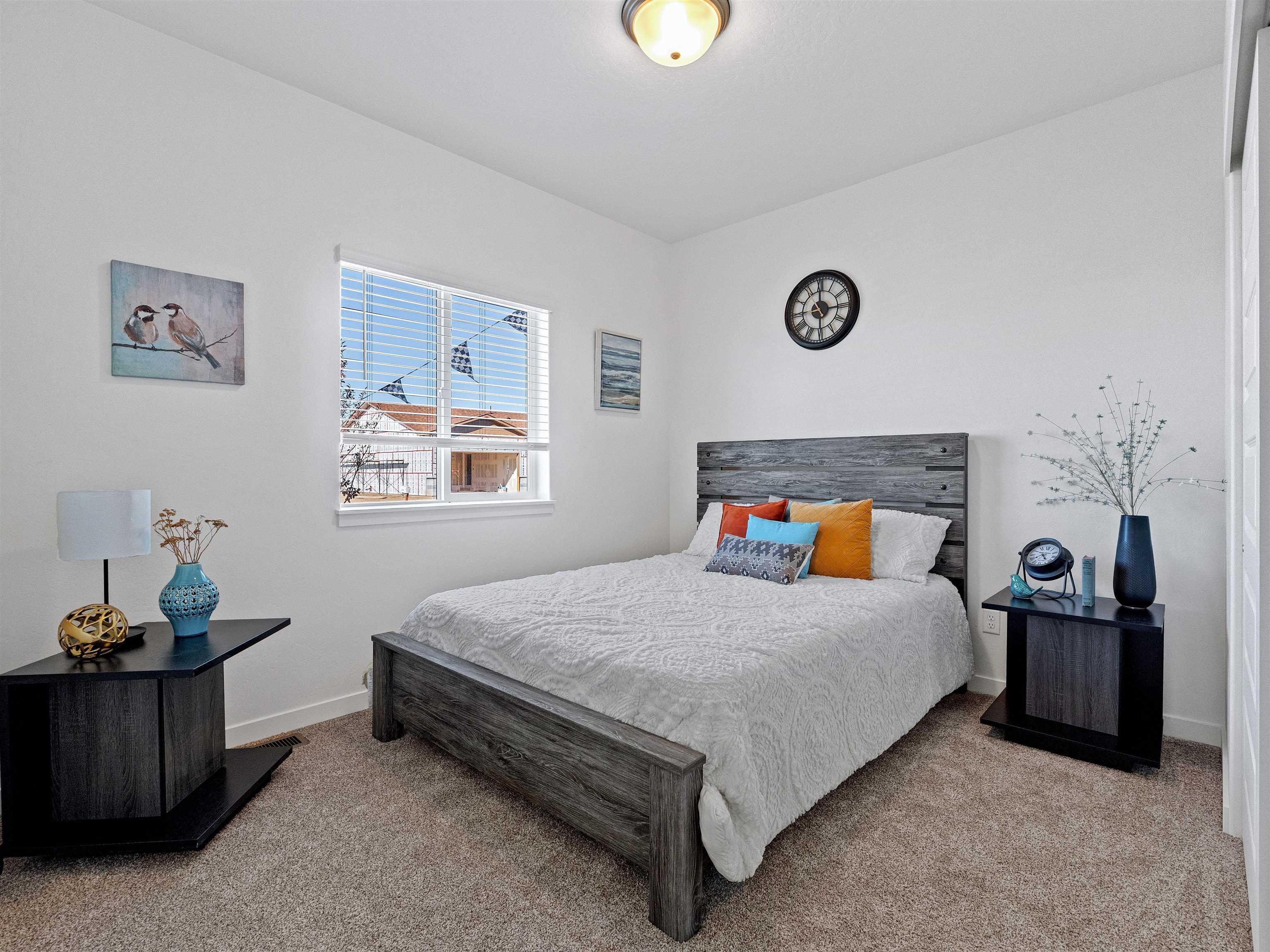 2147 Moon River Road Grand Junction, CO 81505 - Photo 20 of 34 a bedroom with a bed and a window