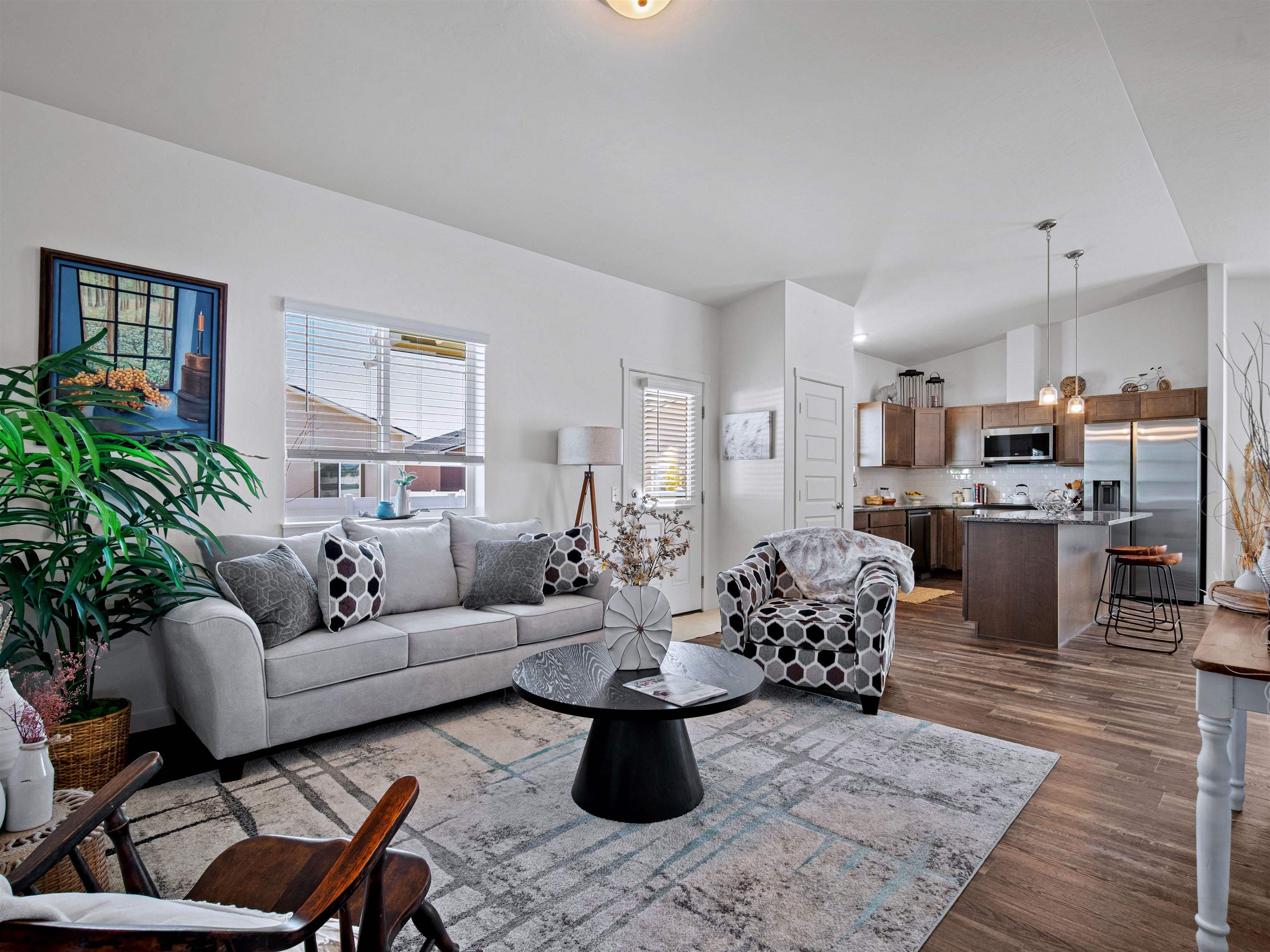 2147 Moon River Road Grand Junction, CO 81505 - Photo 2 of 34 a living room with lots of furniture and kitchen view