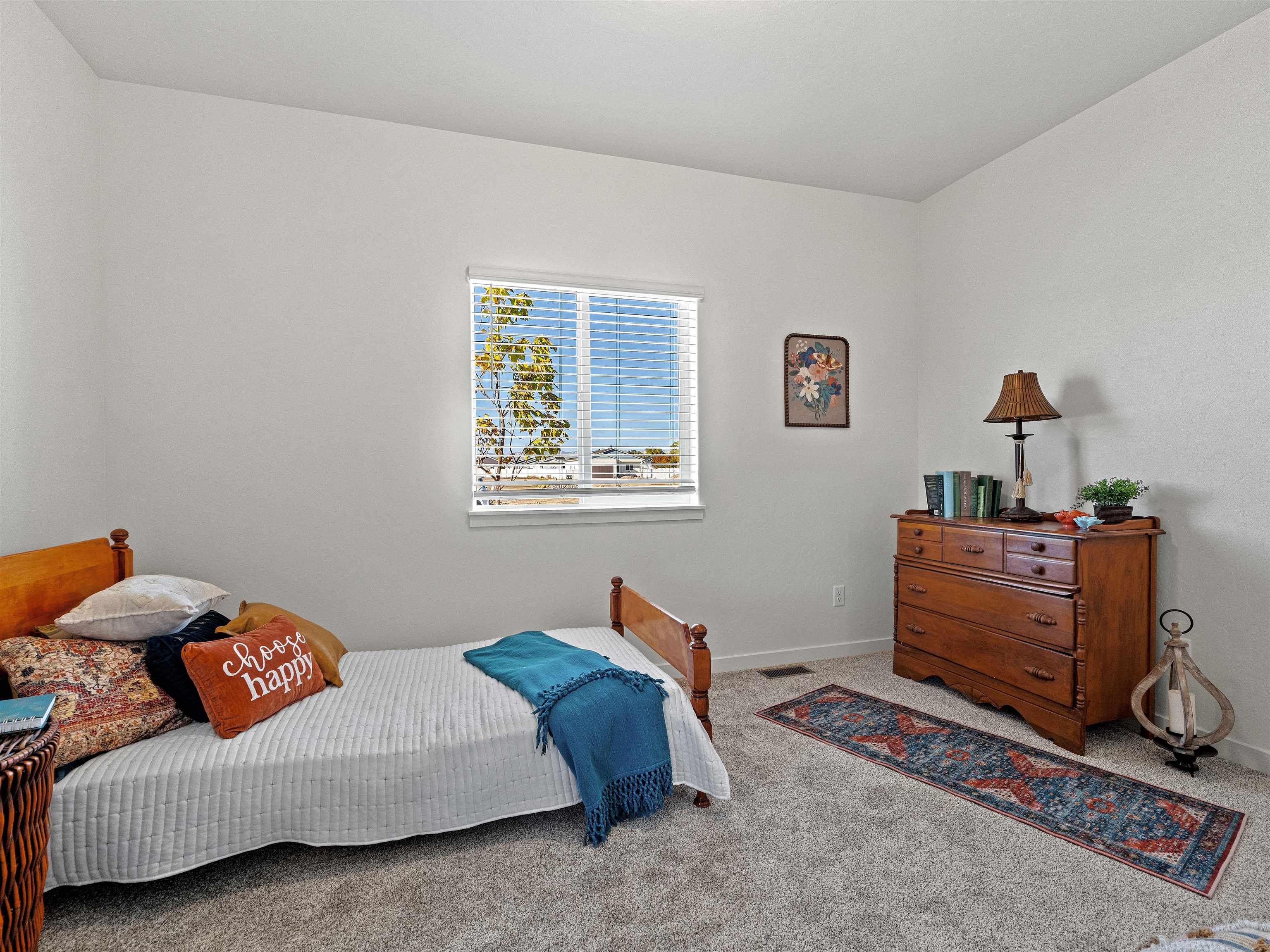 2147 Moon River Road Grand Junction, CO 81505 - Photo 23 of 34 a bedroom with furniture and a window