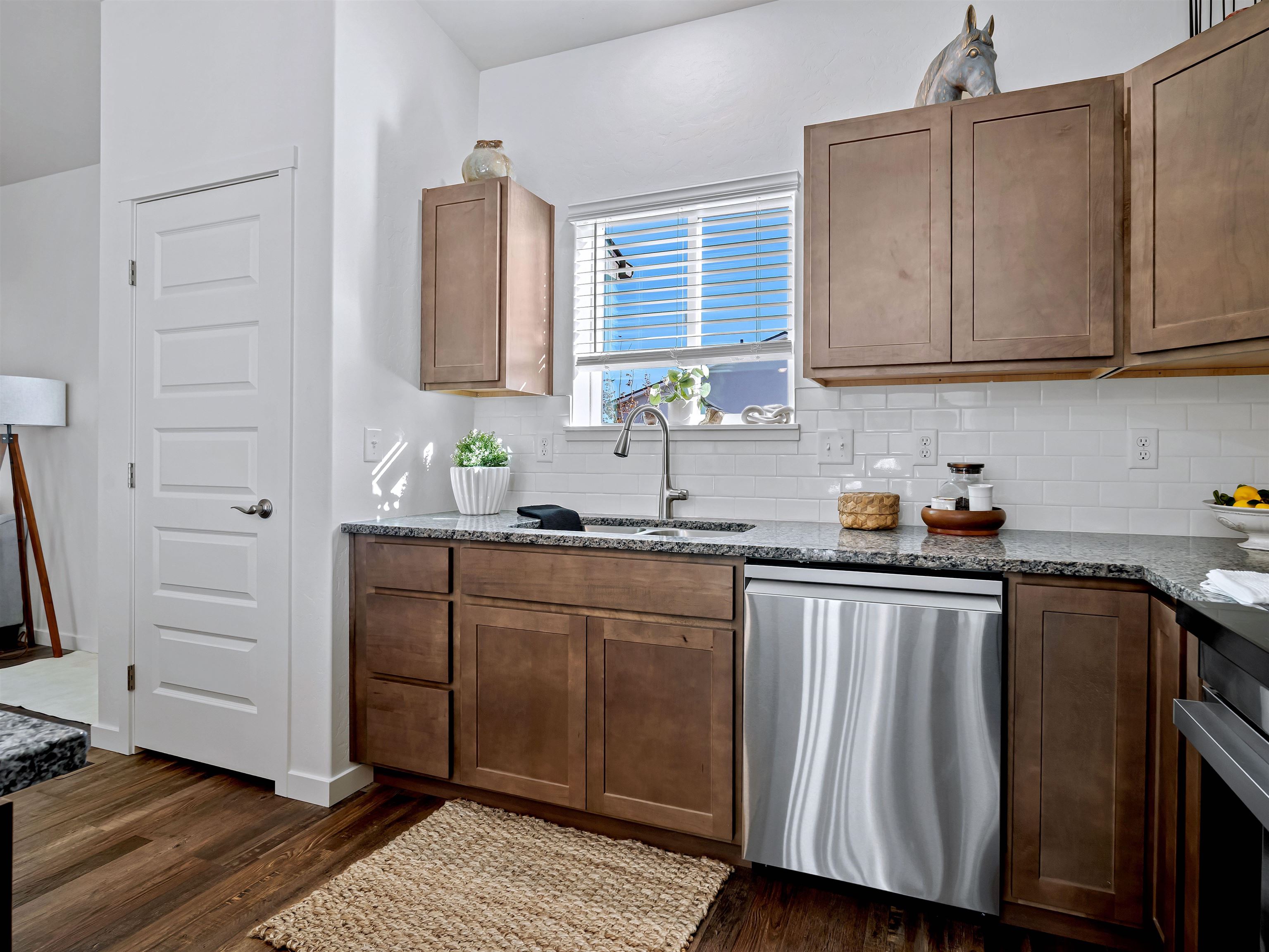 2147 Moon River Road Grand Junction, CO 81505 - Photo 9 of 34 a kitchen with stainless steel appliances granite countertop a sink stove and cabinets