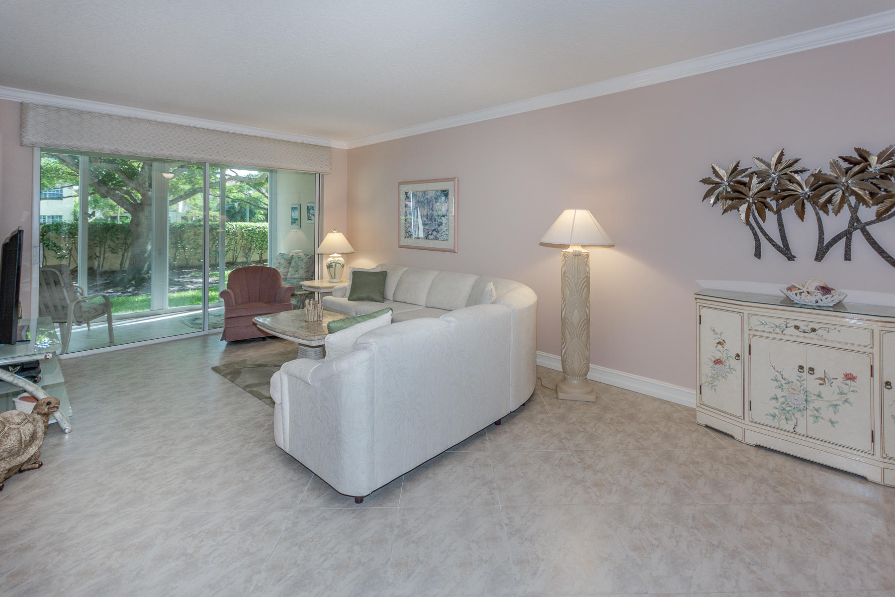 17050 Emile Street, Unit 4 Boca Raton, FL 33487 - Photo 4 of 32 a living room with furniture and a large window