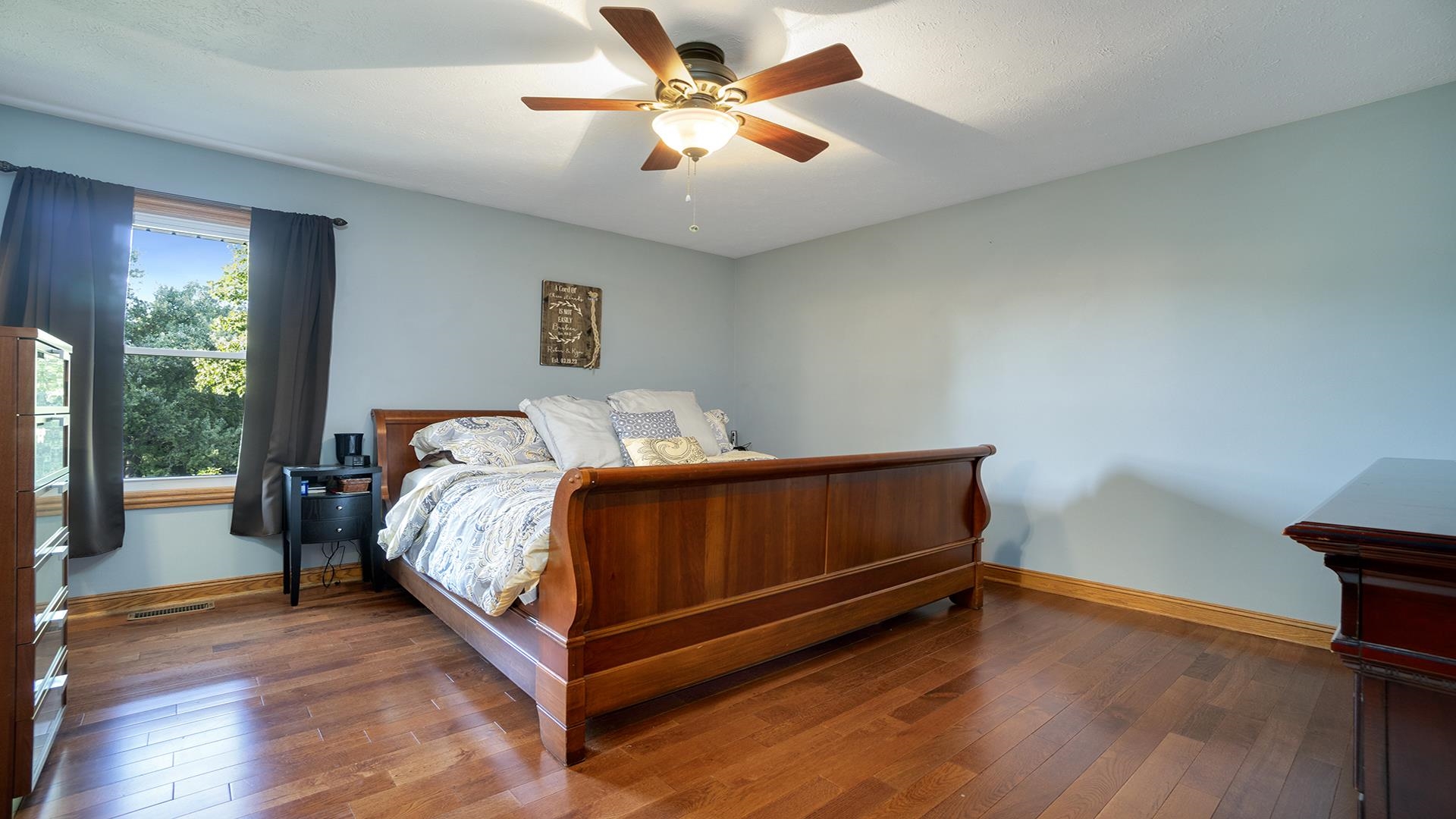 669 Lake Summerset Road Davis, IL 61019 - Photo 16 of 36 a bed room with a bed and a ceiling fan