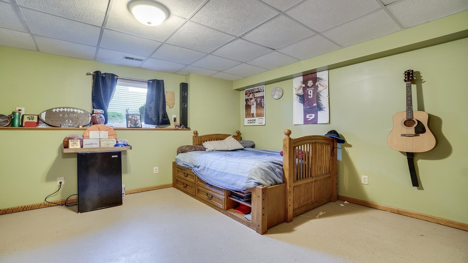 669 Lake Summerset Road Davis, IL 61019 - Photo 25 of 36 a bed room with a bed and dresser