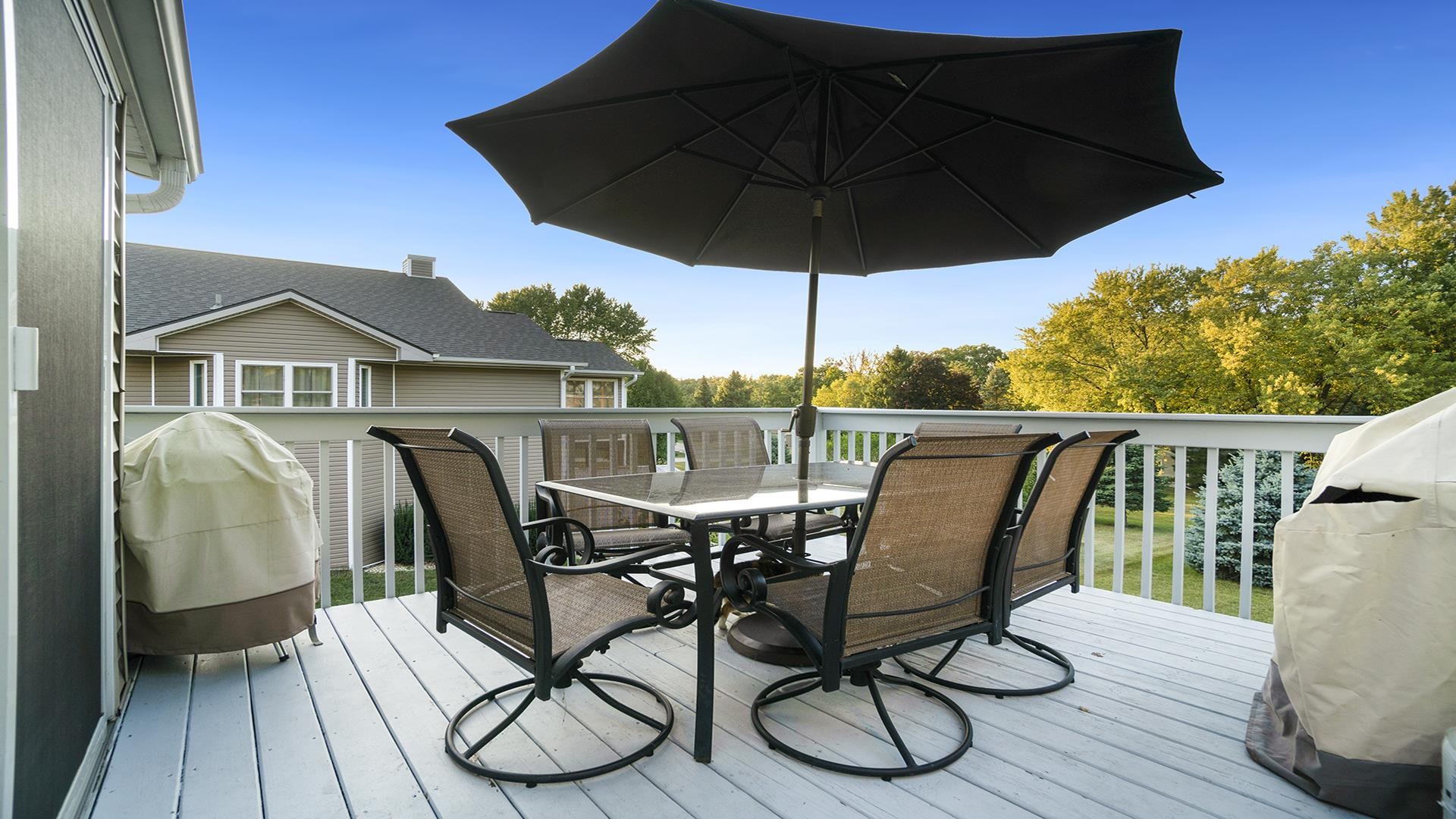 669 Lake Summerset Road Davis, IL 61019 - Photo 28 of 36 a view of balcony with furniture and umbrella