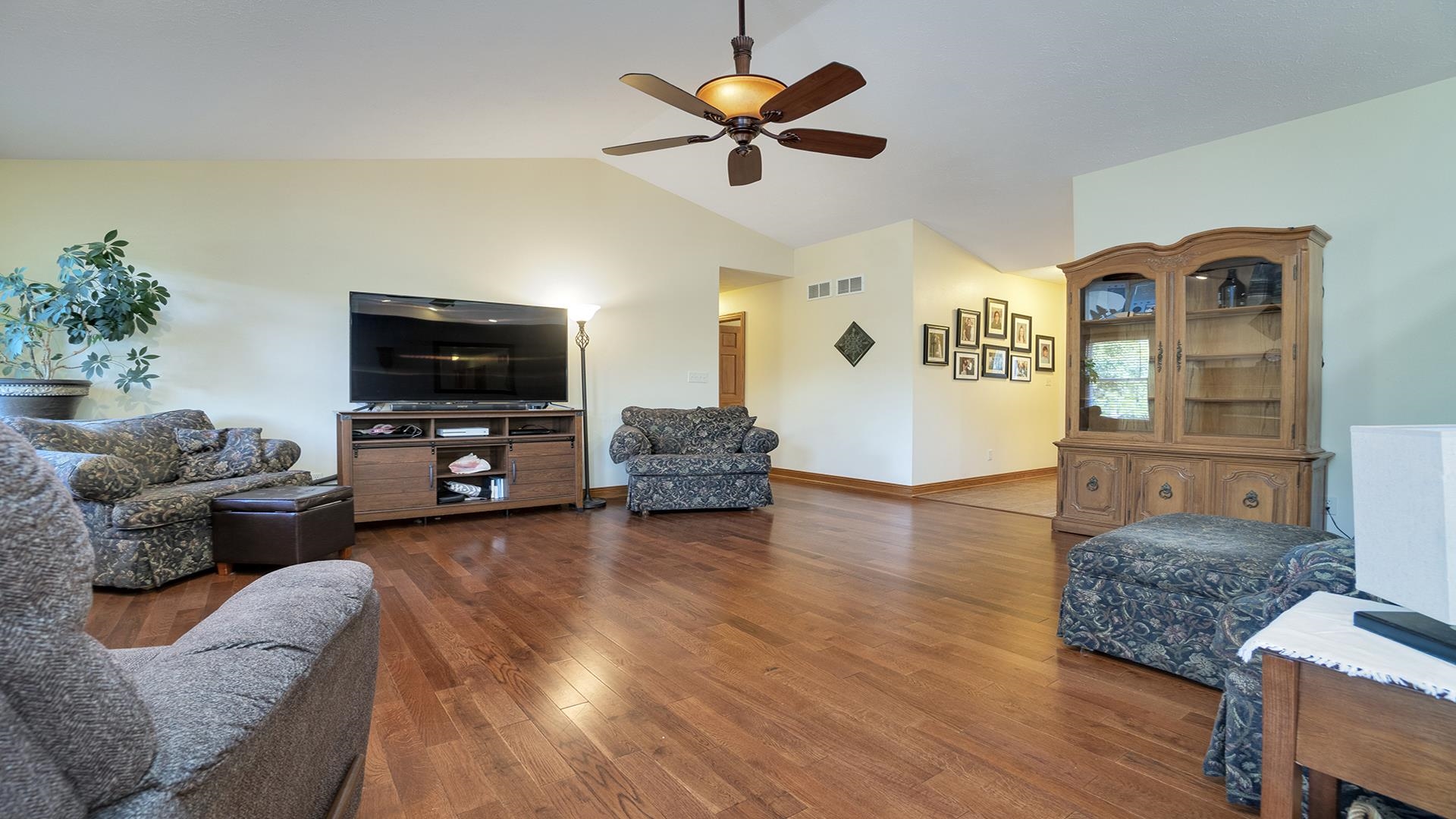 669 Lake Summerset Road Davis, IL 61019 - Photo 4 of 36 a living room with furniture and a flat screen tv