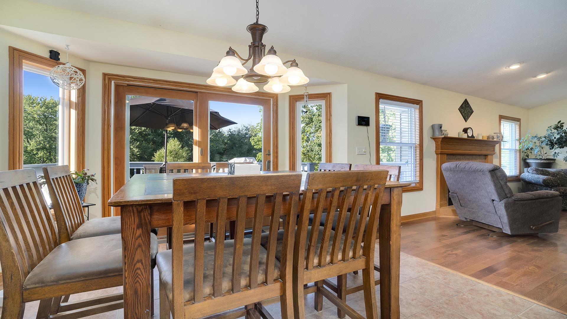 669 Lake Summerset Road Davis, IL 61019 - Photo 7 of 36 a view of a dining room with furniture large windows and a chandelier