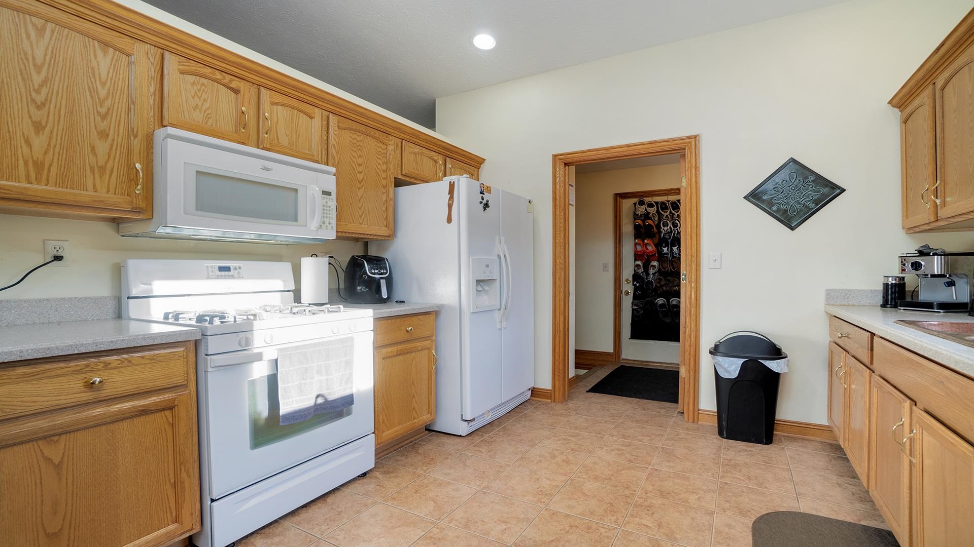 669 Lake Summerset Road Davis, IL 61019 - Photo 9 of 36 a kitchen with a refrigerator and cabinets
