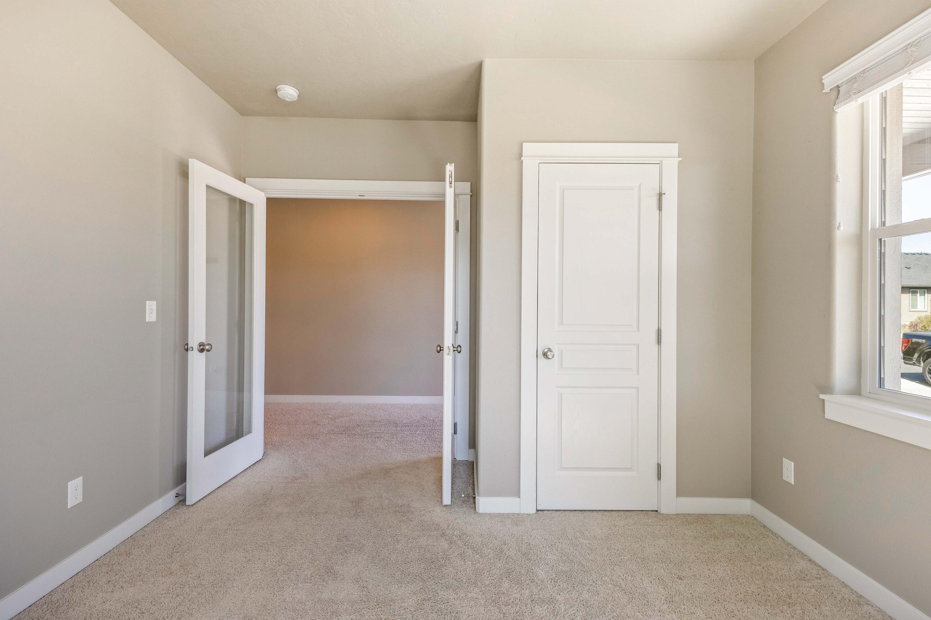 2510 Northwest Hemlock Way Redmond, OR 97756 - Photo 15 of 32 an empty room with windows and closet