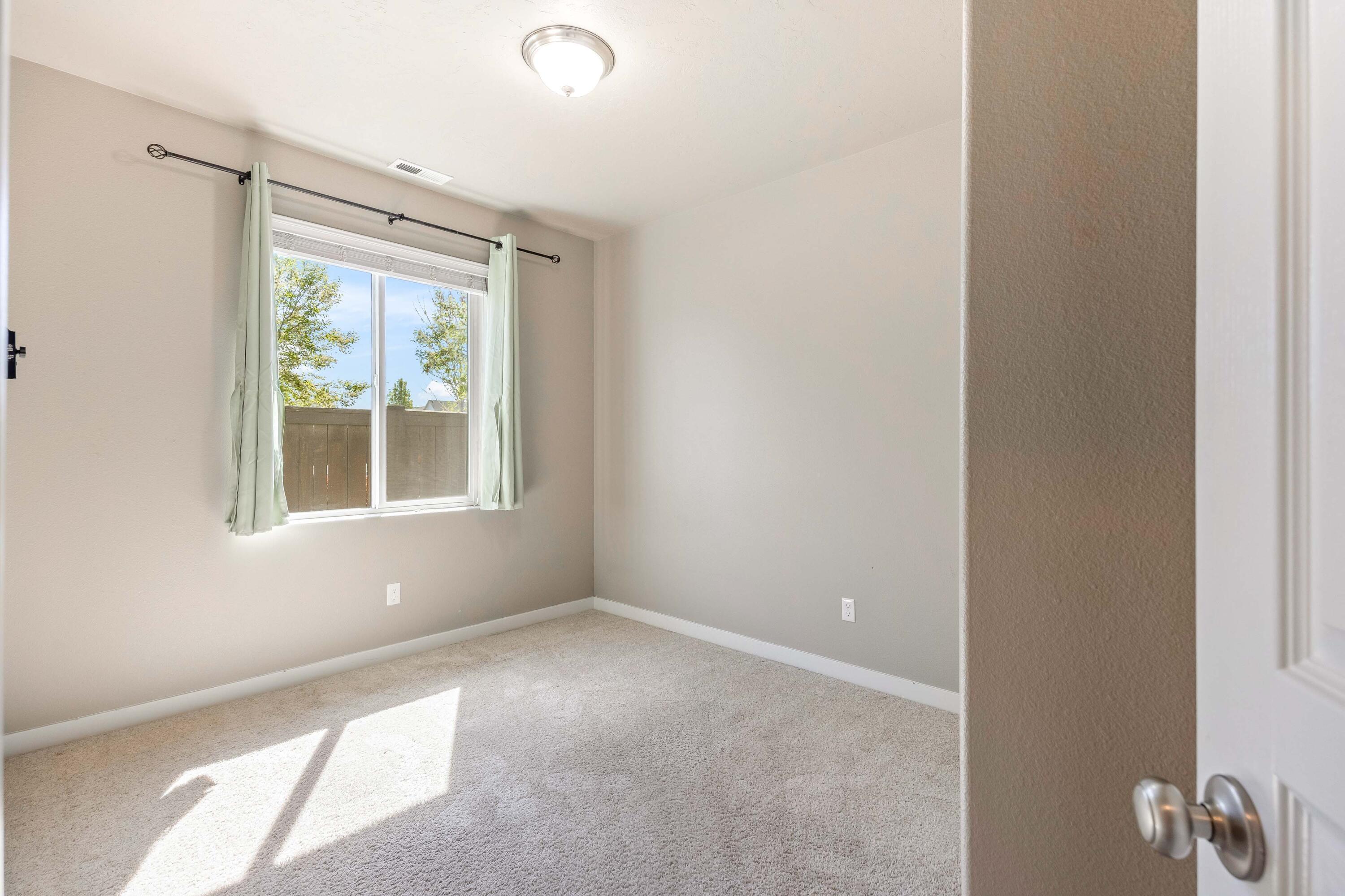 2510 Northwest Hemlock Way Redmond, OR 97756 - Photo 16 of 32 a view of an empty room with a window