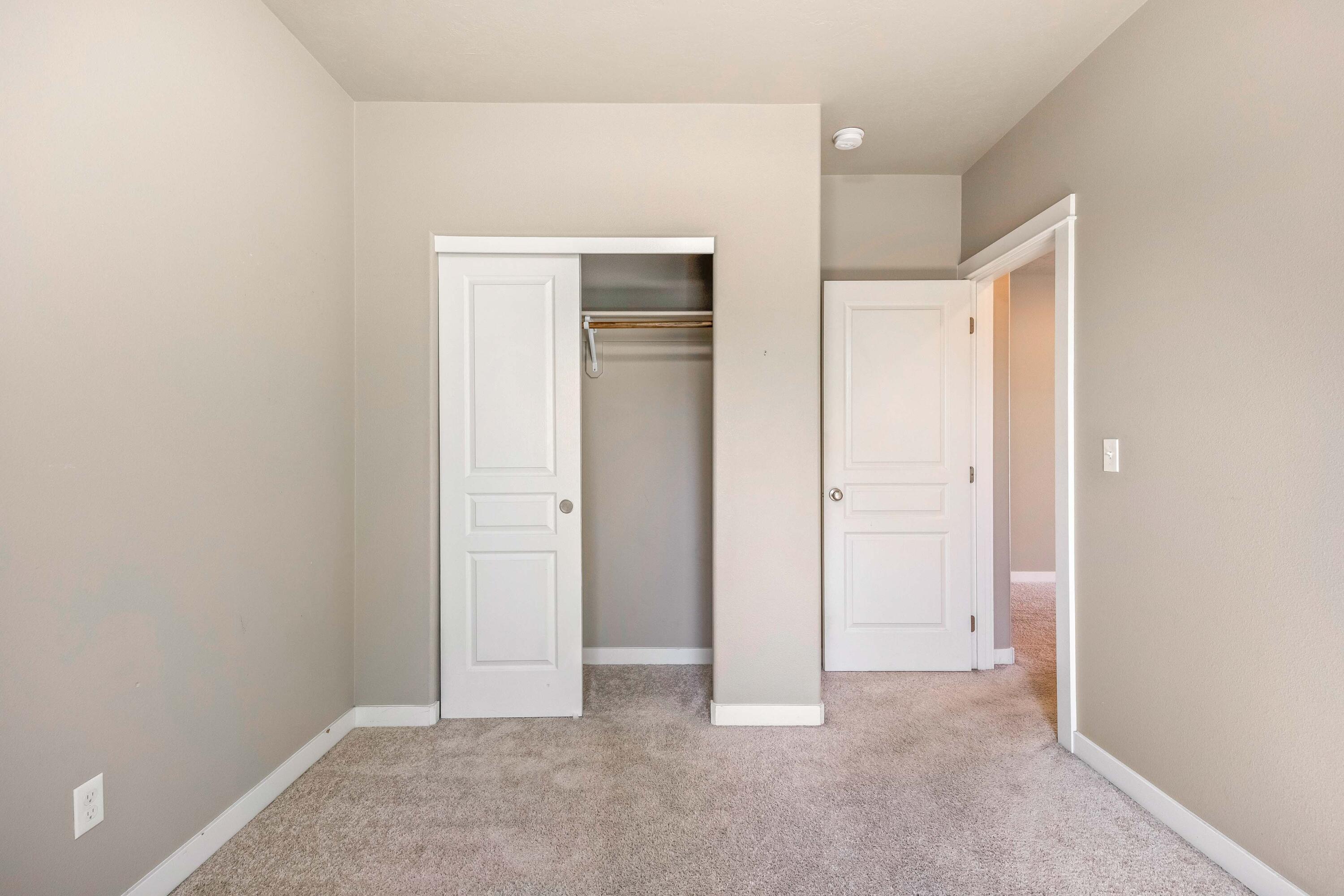 2510 Northwest Hemlock Way Redmond, OR 97756 - Photo 17 of 32 an empty room with closet and a bathroom