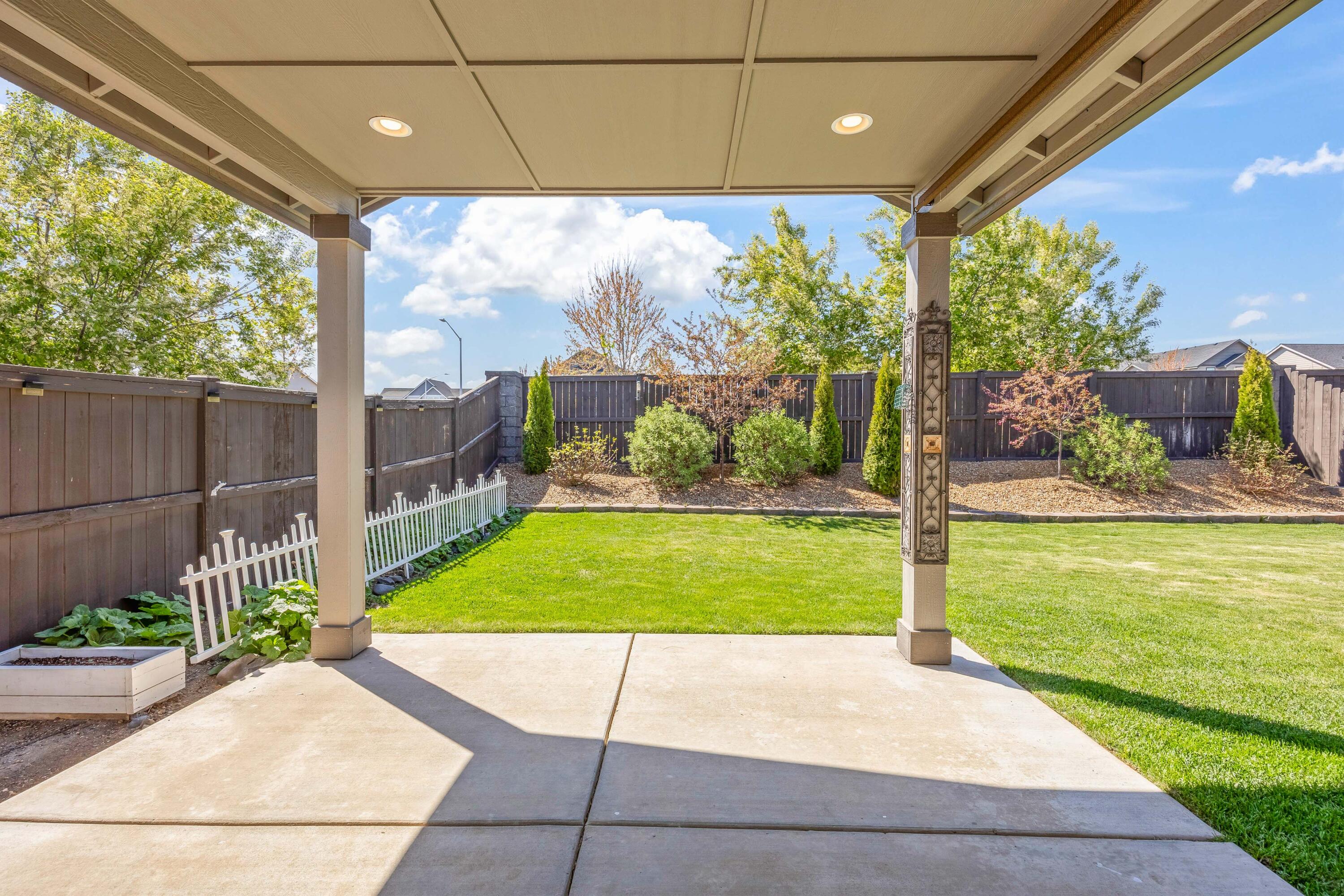2510 Northwest Hemlock Way Redmond, OR 97756 - Photo 21 of 32 a view of a porch with chairs and plants