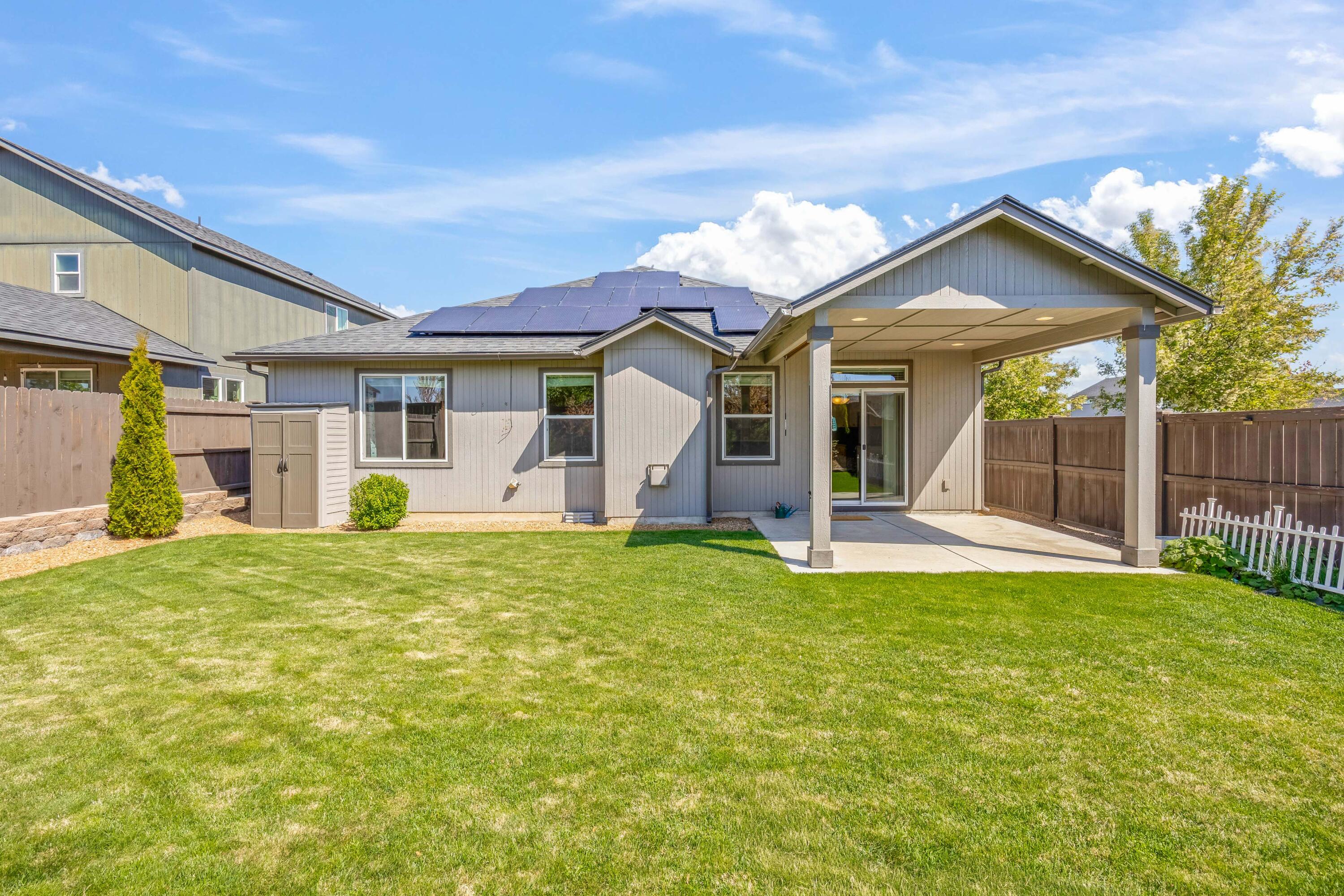 2510 Northwest Hemlock Way Redmond, OR 97756 - Photo 22 of 32 a view of a house with big yard and a large tree