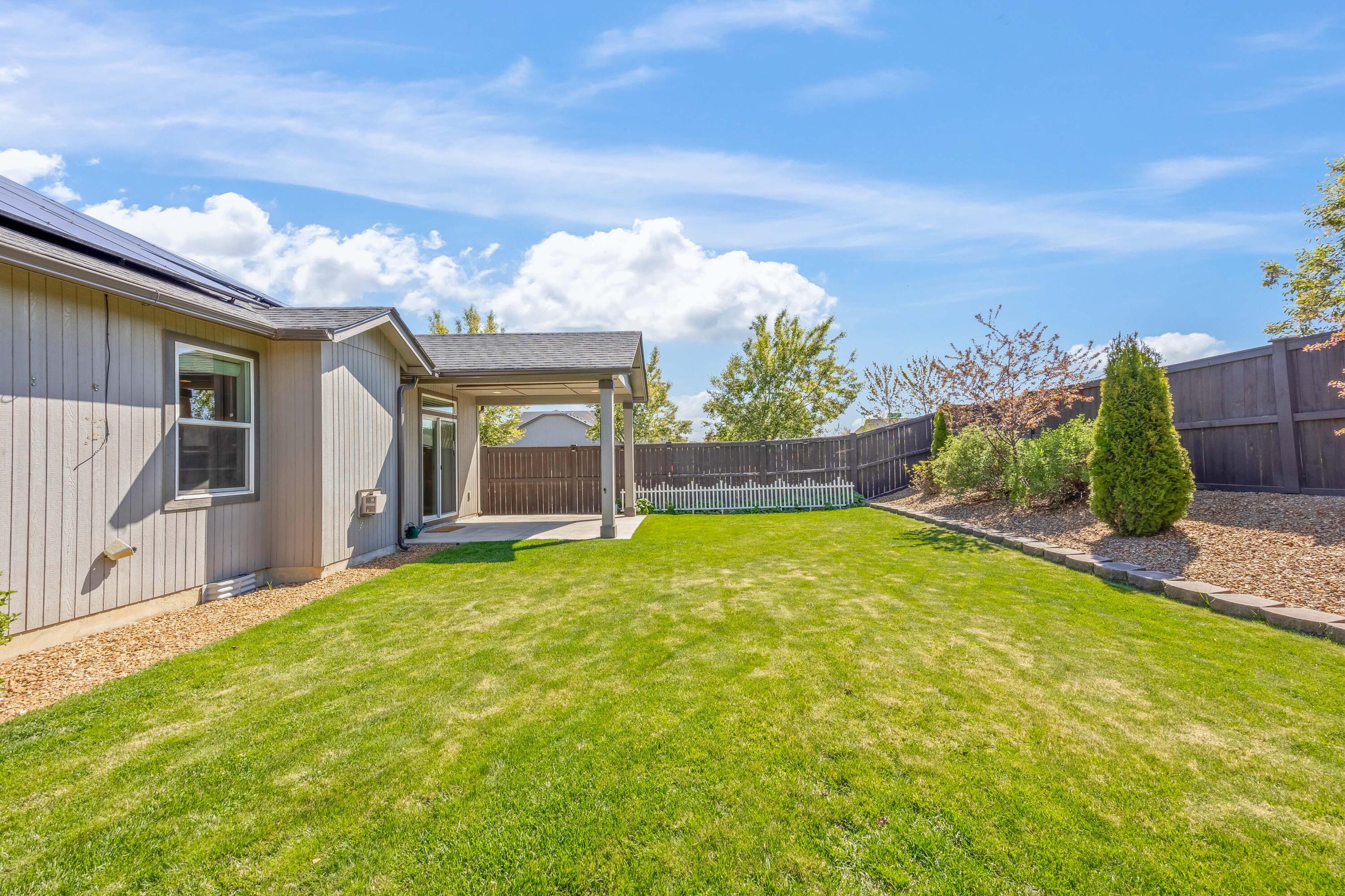 2510 Northwest Hemlock Way Redmond, OR 97756 - Photo 25 of 32 a view of a house with a yard and garage