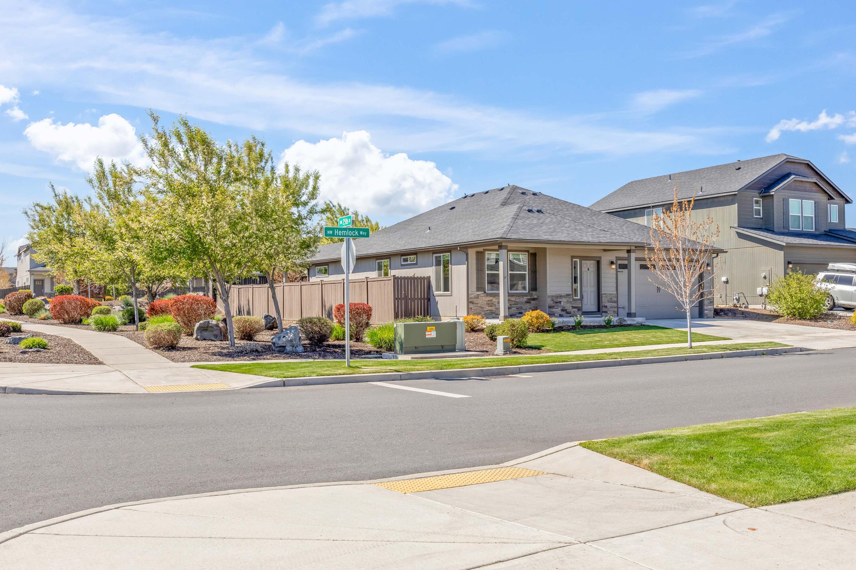 2510 Northwest Hemlock Way Redmond, OR 97756 - Photo 3 of 32 a view of swimming pool with outdoor seating and house in the background