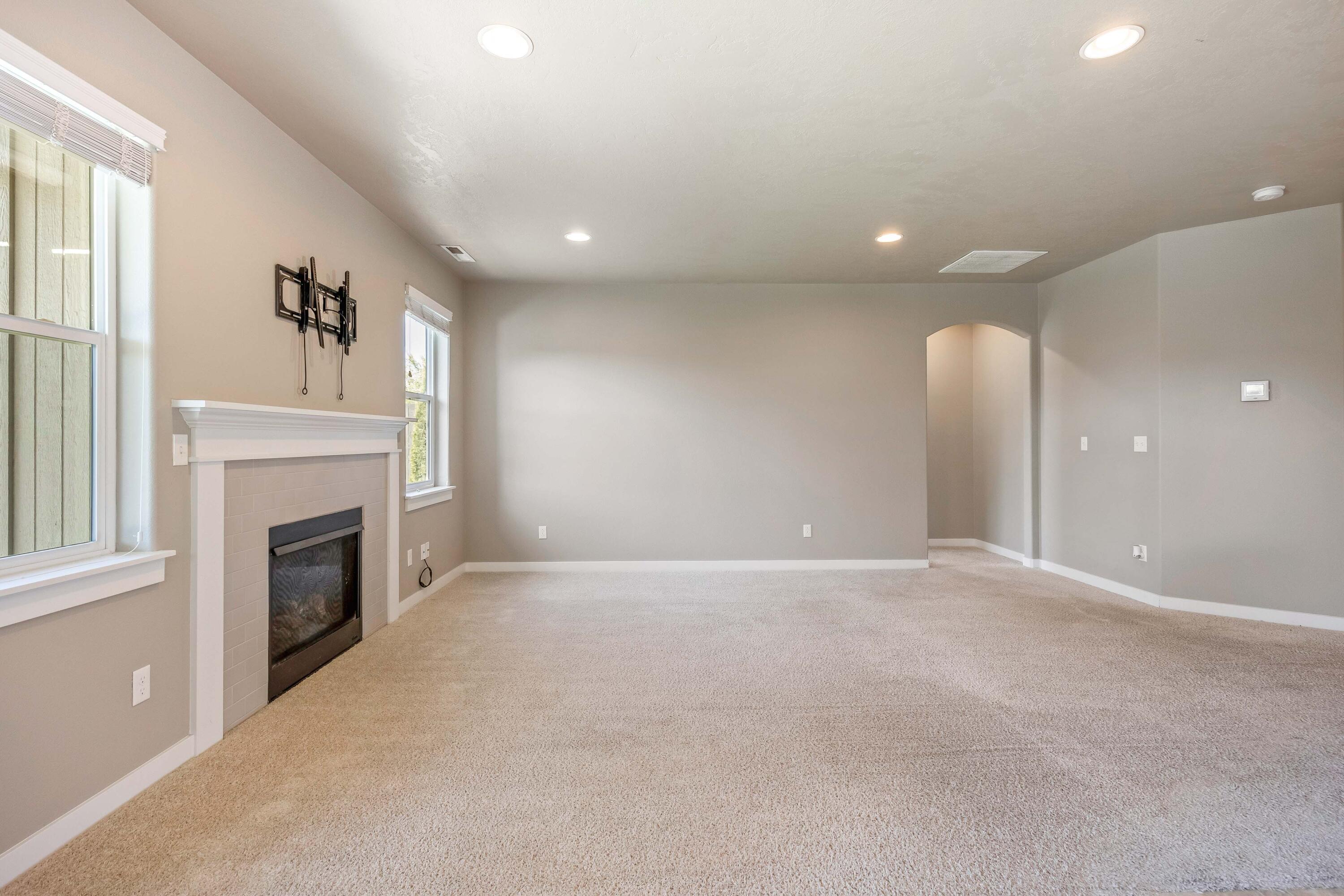 2510 Northwest Hemlock Way Redmond, OR 97756 - Photo 5 of 32 a view of an empty room with a fireplace