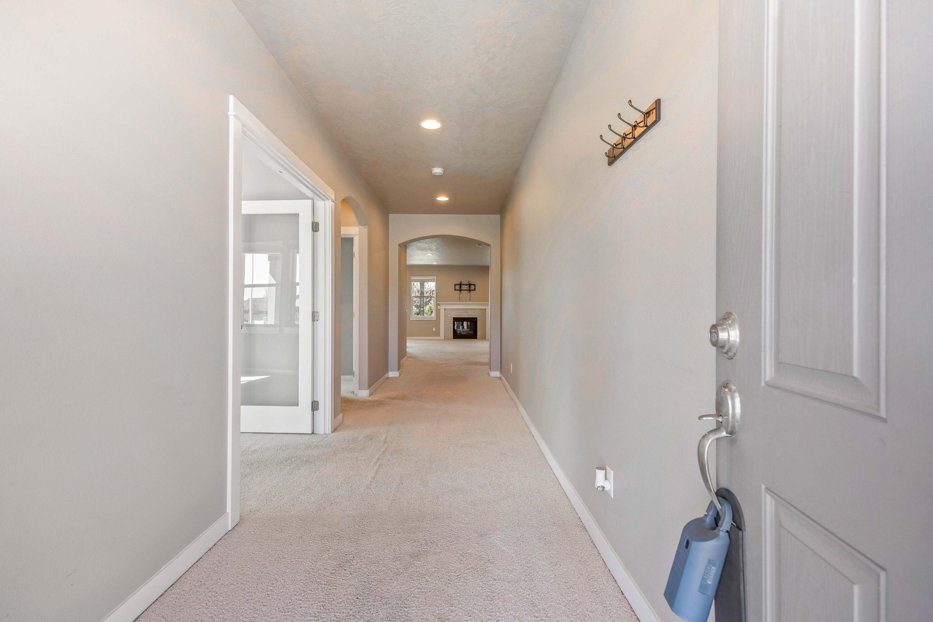 2510 Northwest Hemlock Way Redmond, OR 97756 - Photo 10 of 32 a view of a hallway with wooden shelves