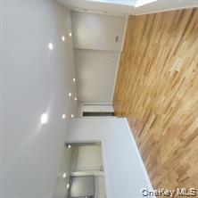 343 Jackson Street, Unit 4 Hempstead, NY 11550 - Photo 4 of 7 Spare room featuring recessed lighting and light wood-style flooring