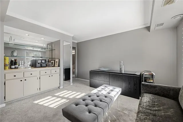 a kitchen with stainless steel appliances kitchen island granite countertop a sink and cabinets
