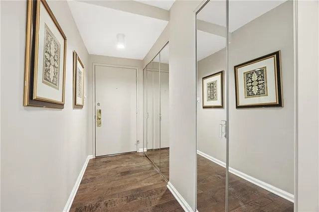 a view of a hallway with paintings on the wall